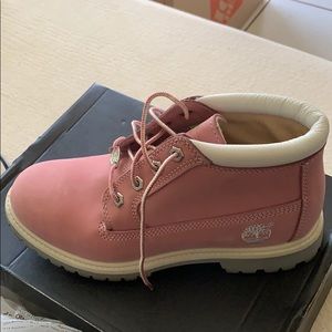 Pink Timberland boots.